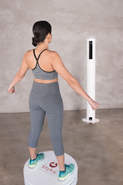 Woman standing on the Styku 3D body scanner at Sarani Wellness in Lake Wylie, SC